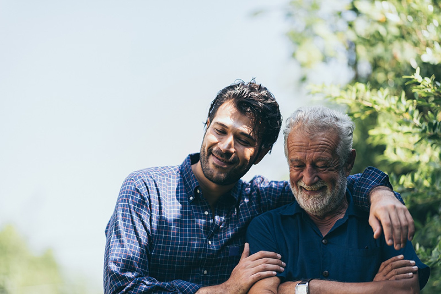 father and son embracing