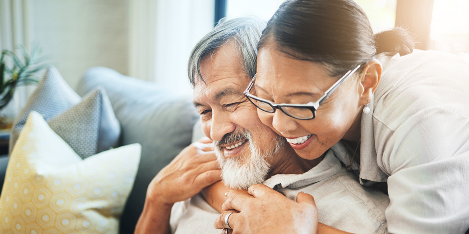 photo of a couple embracing, getting their wills and enduring powers of attorney sorted