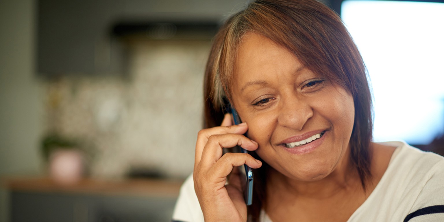 photo of a woman talking on the phone