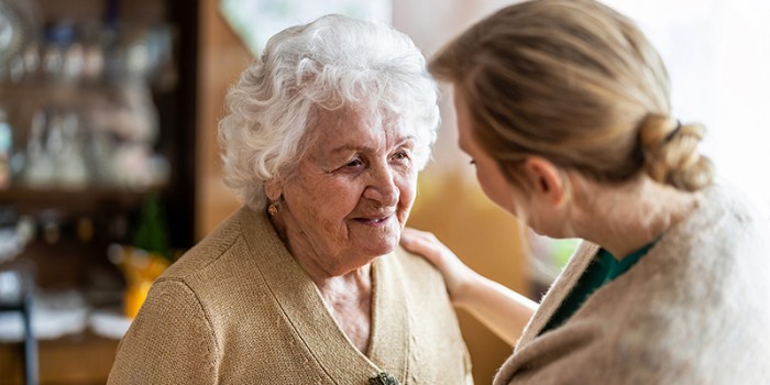 older woman being cared for by a family member