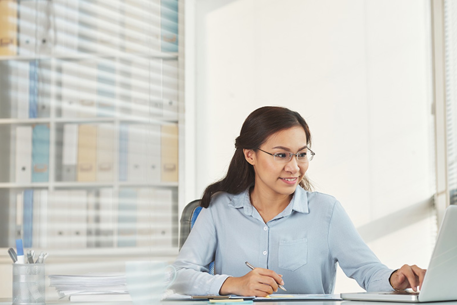 woman working at her desk