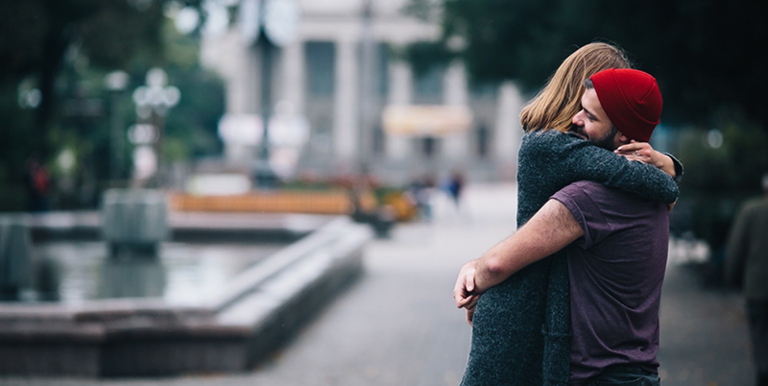 couple embracing in a moody setting