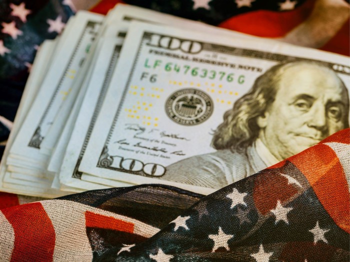 photo of US dollar and US flag